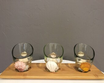 Glass votive Candle Holder with wood stand and seashells accent.