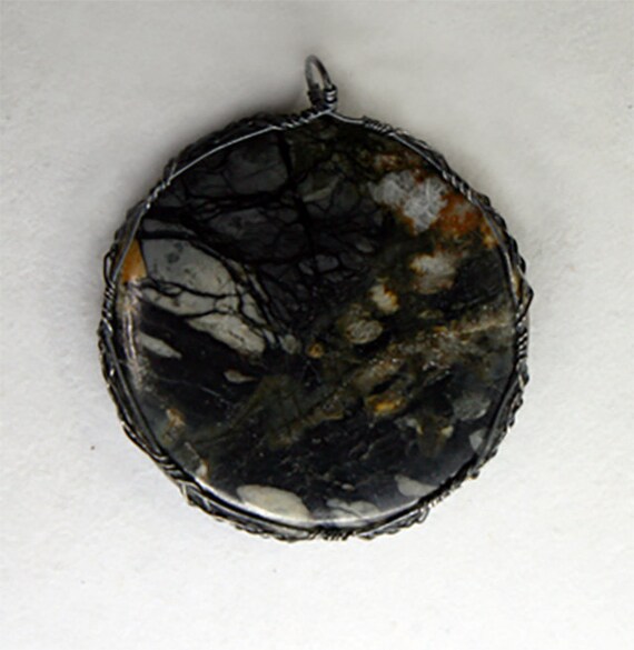 Cabochon of Picasso jasper in a Celtic wrap