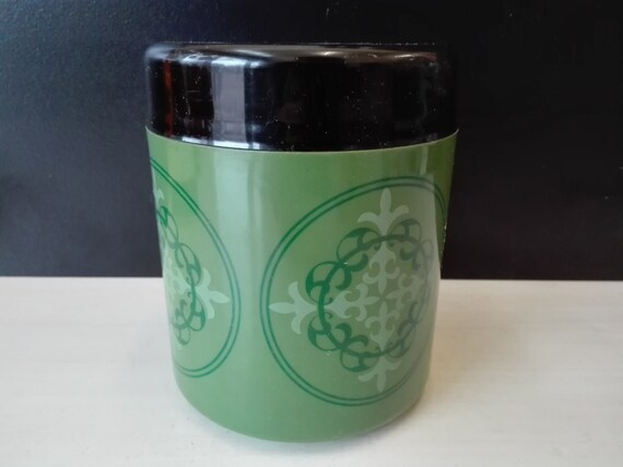 Green plastic storage canister