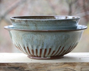 Set of ceramic fluted serving bowls. Stoneware fruit bowl and serving bowl