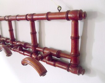 Antique coat rack French hat rack with retractable pegs Pine wood with dark red lacquer coat rack 4 adjustable pegs wall mounted early 1900s