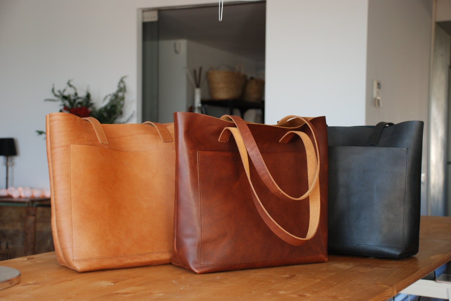 Tan / Cognac Leather tote bag with large outside pocket.