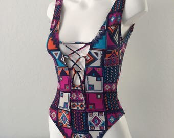 One piece swimsuit.