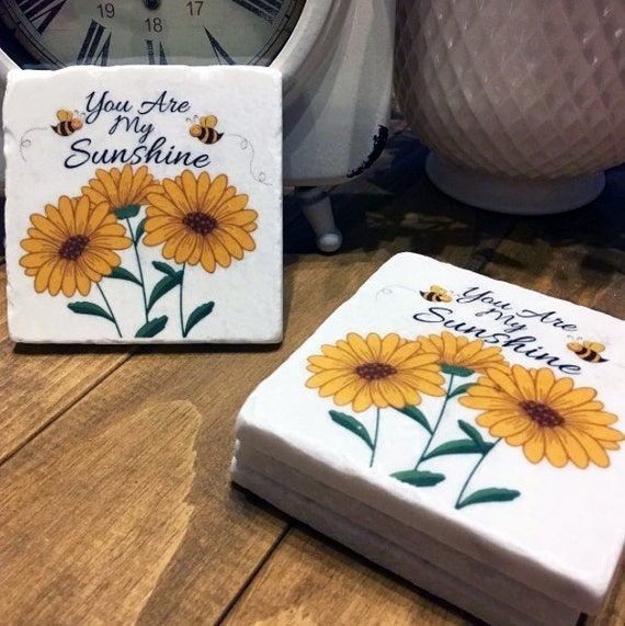 You Are My Sunshine Coasters, Set of 4, made on a beautiful tumbled marble called Meram Blanc Sunflower design Yellow Flowers