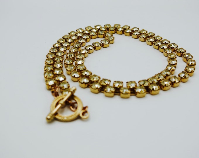 Make a statement with this long 32" yellow crystal golden shadow Swarovski crystal chain necklace.
