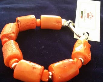 Orange Bamboo coral-rigid bracelet with sterling silver clasp.