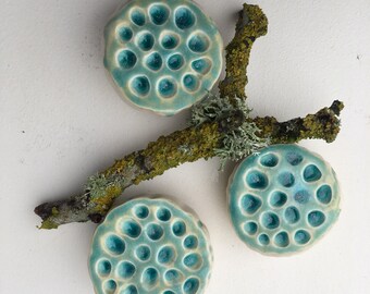 Turquoise and Cream White Ceramic Holey Lotus Wall Art Pod with Blue Glass Set of Three