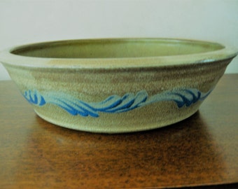 Blue swirls on bronze pie plate