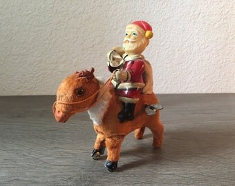 Vintage Tin Santa on Reindeer Mechanical Wind up Jumping Toy