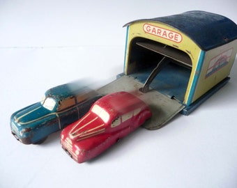 Tin toys double garage by H. W. N.