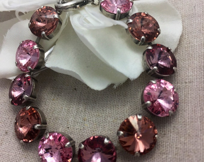 Pink Valentine's Statement bracelet adorned with 12mm rivoli Swarovski crystals in an ombre of pink that provide plenty of sparkle.