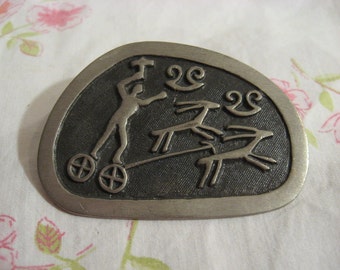 Signed, Modernist vintage Pewter brooch, Made in Sweden w raised chariot driver The kings Grave at Kivik
