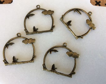 Antique bronze bird stand charm pendant