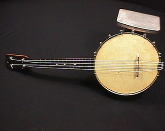 Vintage Banjo - Ukulele in Great Ready to Play Condition with New Strings Tuners,Bridge, and Tailpiece with a Real Skin Top