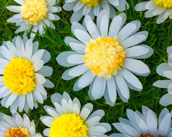 Handmade daisy brooches, made from upcycled plastic bottles, plastic bags and woo. Very unique, sustainable and environmentally friendly.