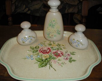 The Vanity Collection from avon has a distinctive tray and 3 bottles with a rose motif.