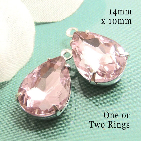 pink glass teardrop beads in silver or brass prong settings... DIY pendants or earring jewels