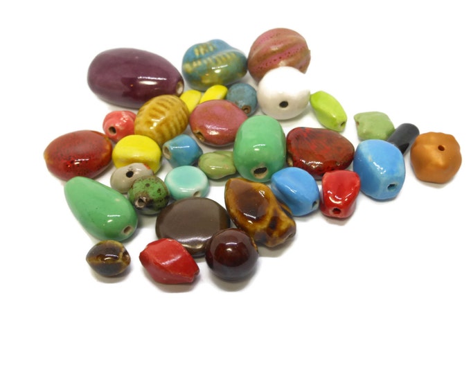 Marble bead lot, colorful collection of beads, ranging in size from 40cm X 20cm to 10cm X 5cm