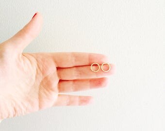 Brushed gold circle minimalist stud post earrings.