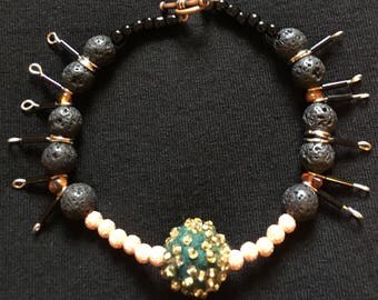 Positive energetic lava amber felted beaded bracelet