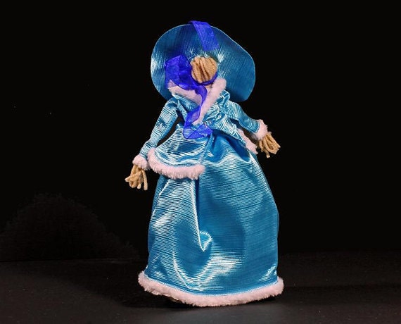 Art Doll, Folk Art Doll, Yarn Doll Art Doll, Folk Art Doll, Yarn Doll Art Doll, Folk Art Doll, Yarn Doll Art Doll, Folk Art Doll, Yarn Doll Art Doll, Folk Art Doll, Yarn Doll 🔎zoom Request a custom order and have something made just for you. Item details 5 out of 5 stars. (61) reviews Shipping & Policies Art Doll, Folk Art Doll, Yarn Doll This is a folk art doll on her way to an afternoon tea. She is wearing her stunning blue holiday outfit. She is ready to celebrate the holiday with her friends in the afternoon and then on to the big Christmas party that evening. She would love to come to yours. This folk art doll is like one of the first dolls I ever had. My mother taught me to make these. She learned to make these herself when she was a little girl by her mother. The clothes are new and will fit a Barbie or Ken doll. They are small and easy to carry along anywhere. A great fit for small childrens hands. For Adults, they make a great stress reliever. Placed on your desk or in your car. Always there and a friend when you need one. The dolls add a nice touch of bygone days to any room in your home. Give this as a gift to a child to love, to yourself to relieve stress and make you smile, or to a friend to brighten their day. A truly unique gift idea for holidays, birthdays. or anytime. Machine wash and dry. So pick one up give him or her a name and have a friend for life. Multicolored dress, blue shoes, and she carries a blue evening bag. *******NOT FOR SMALL CHILDREN--CONTAINS SMALL PIECES******** For more Folk Art Dolls please click here: https://www.etsy.com/shop/ADKArtsBoutique?section_id=14178229&ref=shopsection_leftnav_3 ©For People Who Have A Deep Love Of Things Adirondack Meet the owners of ADKArtsBoutique Learn more about their shop and process Patti Turon Joseph Turon Seymour Montrose Weatherby Frequently asked questions about ADKArtsBoutique Custom and personalized orders Gift wrapping and packaging Art Doll, Folk Art Doll, Yarn Doll