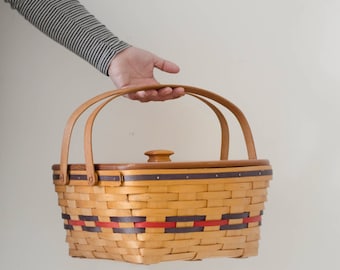 Vintage picnic basket with wooden lid