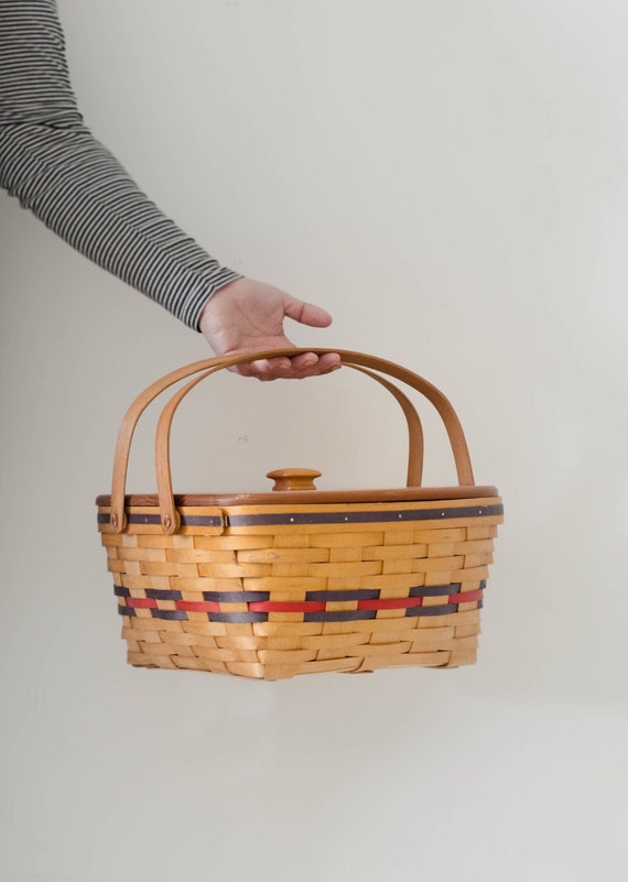 Vintage picnic basket with wooden lid