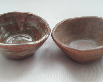Two handmade pinch pot ceramic salt and pepper bowls Brown and Green