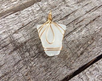 Wire wrapped clear sea glass pendant