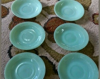 Vintage Jadite fireking saucers. Set of 8