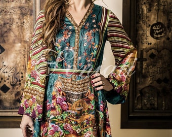 Digital print finest silk stylish A line shirt with front lifted and side doping. Loose fit shirt with printed silk belt for a fitted look.