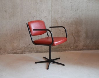 1970’s mid century swivel office chair upholstered in red vinyl