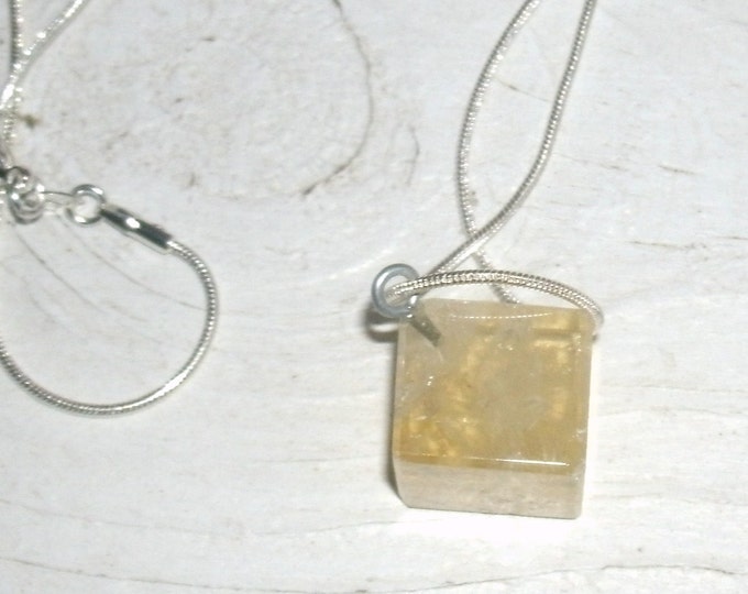 Lemon Quartz Cube Necklace, eye pin hanger, hangs on a diagonal, light showing translucent light yellow crystal, 925 stamped sterling chain