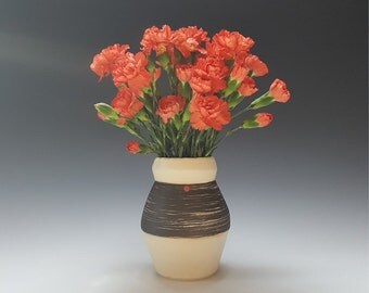 Handmade ceramic flower vase by Potteryi. Black and white vase with red dot.