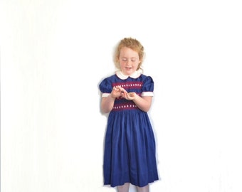 1960 smocked little girl dress . peter pan collar . traditional navy blue red embroidery .sale