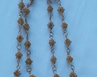 431. Thirty inch lacey gold tone brass beaded necklace
