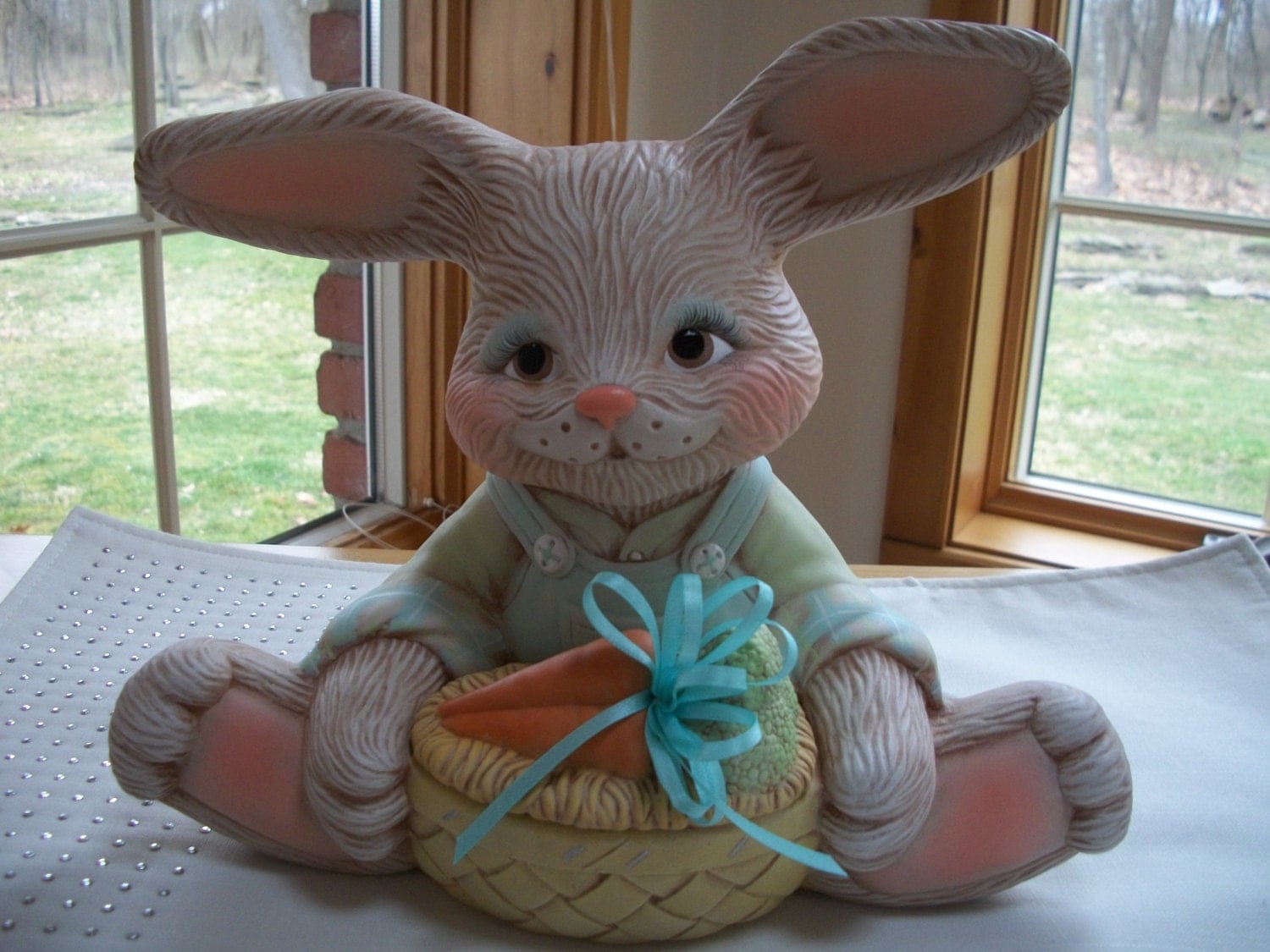 Ceramic Easter Bunny holding egg or carrot basket