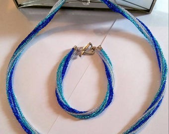 Blue multi strand necklace and bracelet.