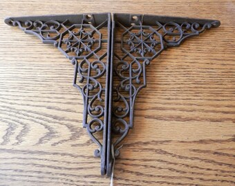 pair (2) antique cast iron shelf brackets with appoligies