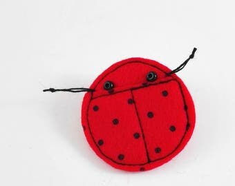 red ladybird brooch