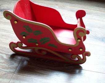 Folding sleigh sled Christmas decor vintage holiday decorations Santa reindeer holly centerpiece dried flowers red gold buffet table retro