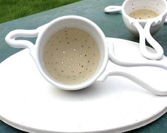 Herbal tea or tea Infuser. Herbal tea infusion prepared past filter. Infuse herbal. Turned by hand. white stoneware.