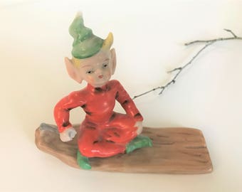 Vintage pixie elf green hat orange Occupied Japan elf sled figurine porcelain kitschy cute nursery decor hand painted collectible miniature