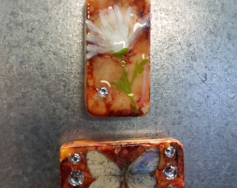 Domino magnet set of 2 orange with white flower and white butterfly and jewels