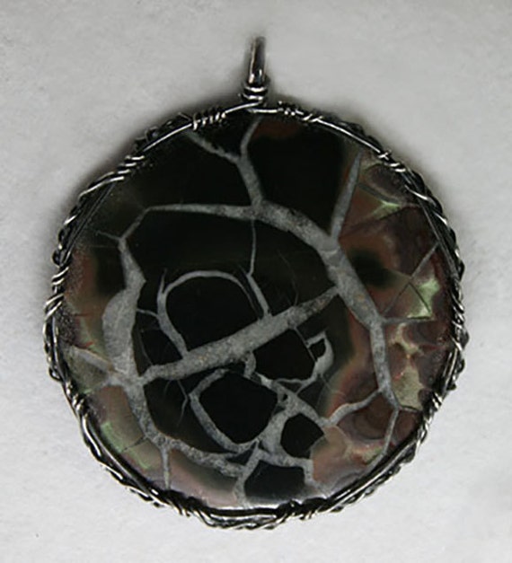 Septarian stone wrapped in a Celtic style with oxidized silver