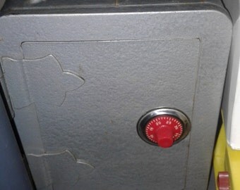 Vintage metal combination safe bank.