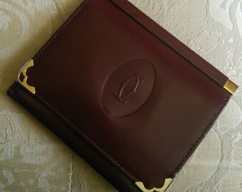 Cartier Folding Wallet in Oxblood leather // iconic French designer, dark burgundy leather, small wallet, perfect to go in evening clutch