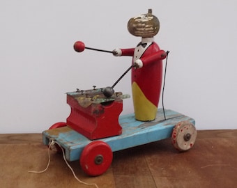 Toy pull wooden wheeled player Xylophone articulated 1920's, Collection wooden toy. Antique french Wooden Pull Toy