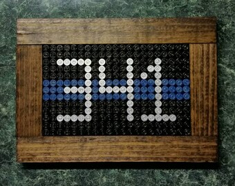 Thin blue line PERSONALIZED bullet casings with badge #, the perfect gift any LEO would love to have