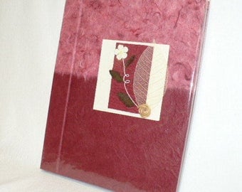 Handmade paper journal, hand bound and decorated cover